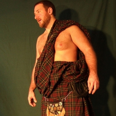 man wearing kilt no shirt